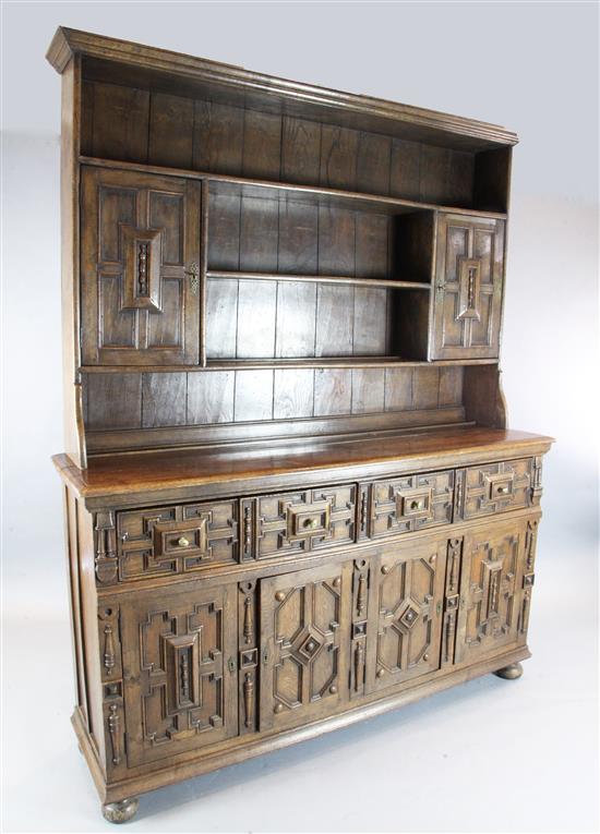 A 17th century style oak dresser, W.6ft D.1ft 8in. H.7ft 6in.
